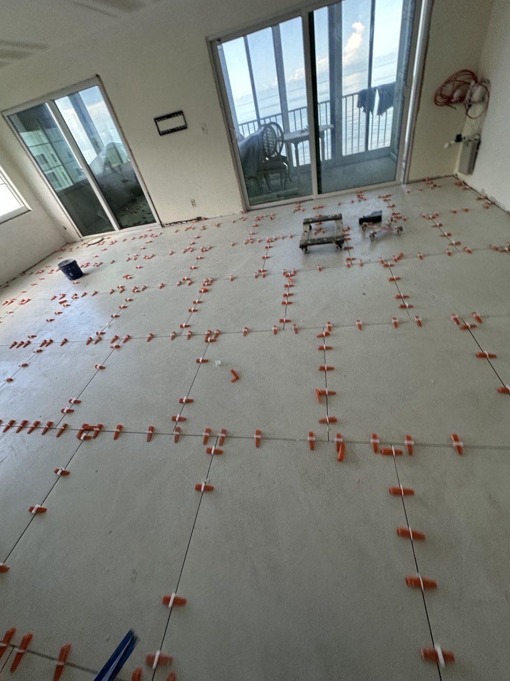 Large-format floor tile installation
